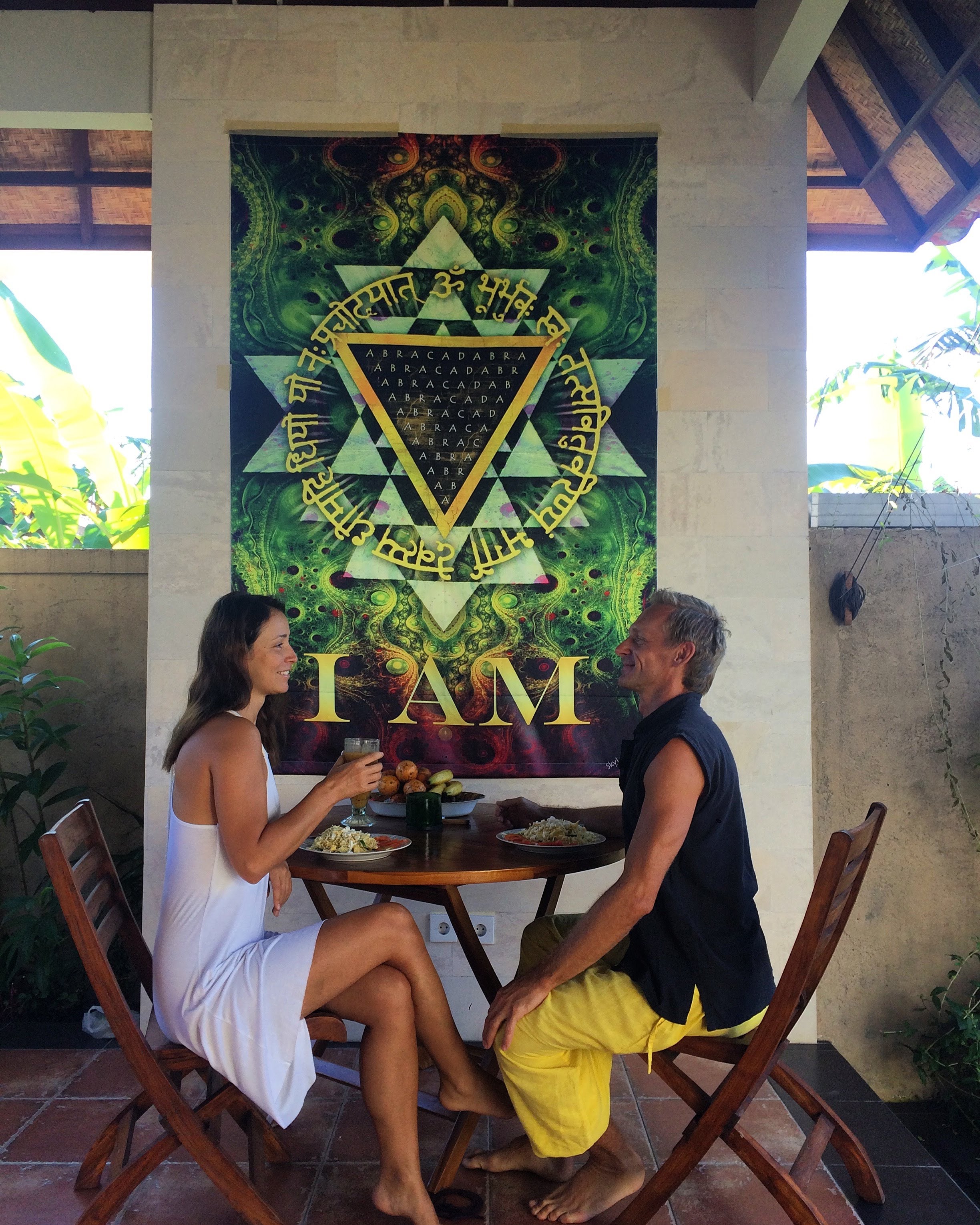 Manifestation Mandala tapestry displayed in a room setting